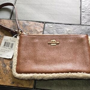 Brown Coach wristlet